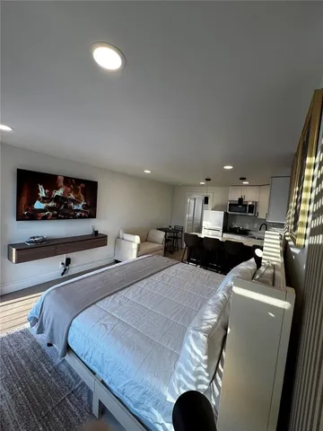 a kitchen with stainless steel appliances granite countertop a refrigerator sink and cabinets