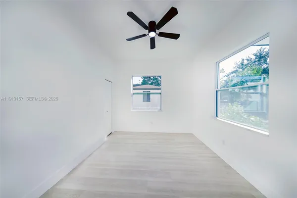 a view of an empty room with a window