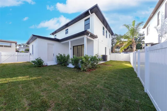 a backyard of a house with lots of green space