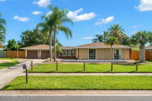 a front view of a house with a yard and porch