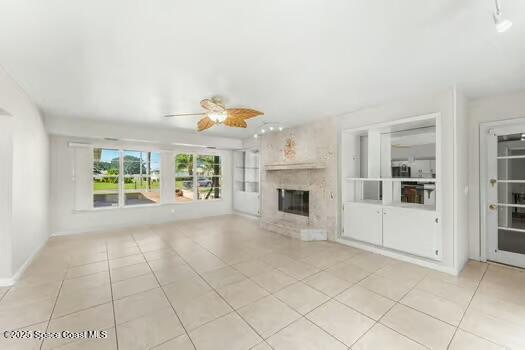 933 Waialae Circle Northeast Palm Bay, FL 32905 - Photo 28 of 32 a view of an empty room with a fireplace and a window