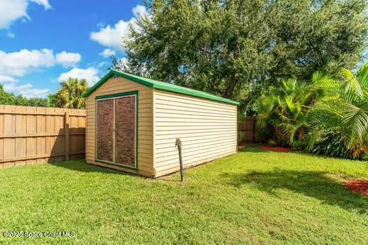 933 Waialae Circle Northeast Palm Bay, FL 32905 - Photo 31 of 32 a view of a back yard of the house