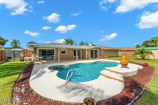 933 Waialae Circle Northeast Palm Bay, FL 32905 - Photo 4 of 32 a view of a house with a backyard