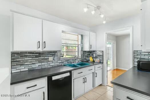 933 Waialae Circle Northeast Palm Bay, FL 32905 - Photo 9 of 32 a kitchen with kitchen island granite countertop a sink stainless steel appliances and cabinets