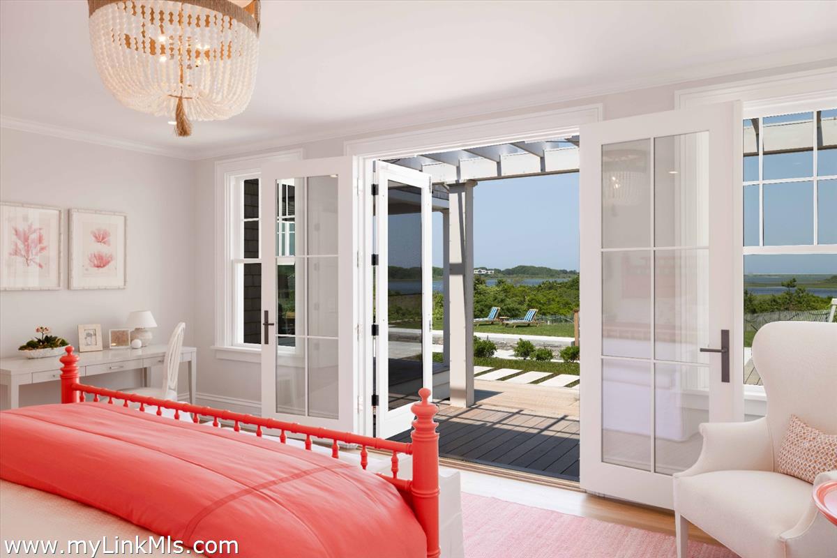 256 Polpis Road Nantucket, MA 02554 - Photo 12 of 30 a bedroom with furniture and large windows