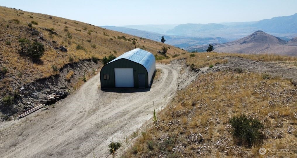 180 Harmony Heights Road Brewster, WA 98812 - Photo 6 of 13 a view of a mountain with a mountain in the background