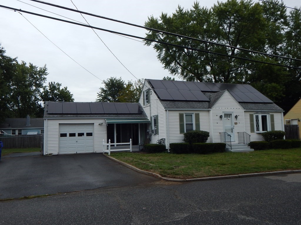 111 Elijah Street Springfield, MA 01109 - Photo 5 of 39 a view of a white house with a big yard and large trees