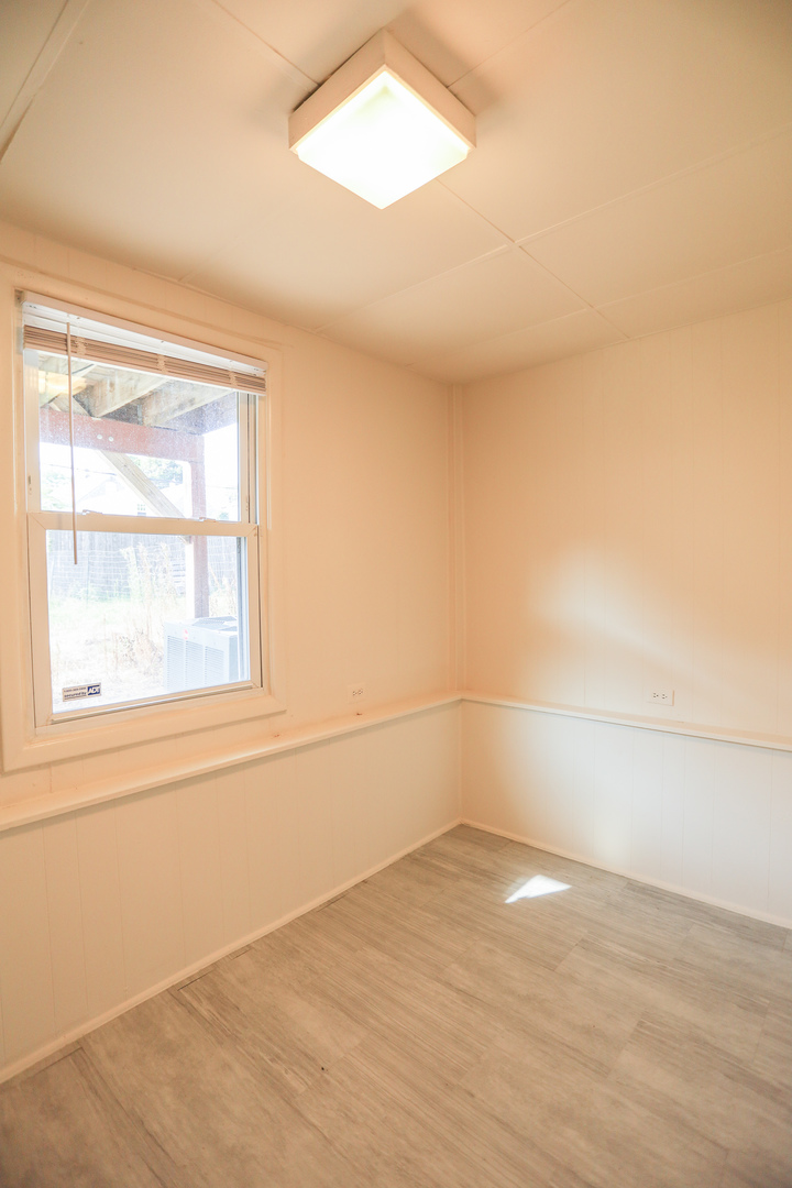 2315 West School Street, Unit G Chicago, IL 60618 - Photo 12 of 12 an empty room with a empty space and a window