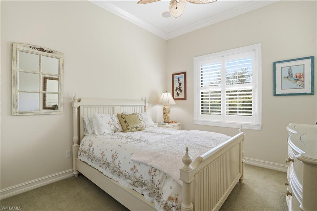 430 Saddlebrook Lane Naples, FL 34110 - Photo 22 of 37 a bedroom with a bed and a window