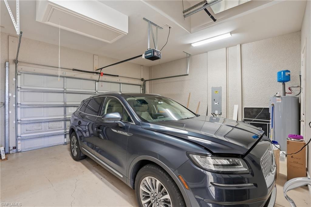 430 Saddlebrook Lane Naples, FL 34110 - Photo 32 of 37 a view of a car in garage