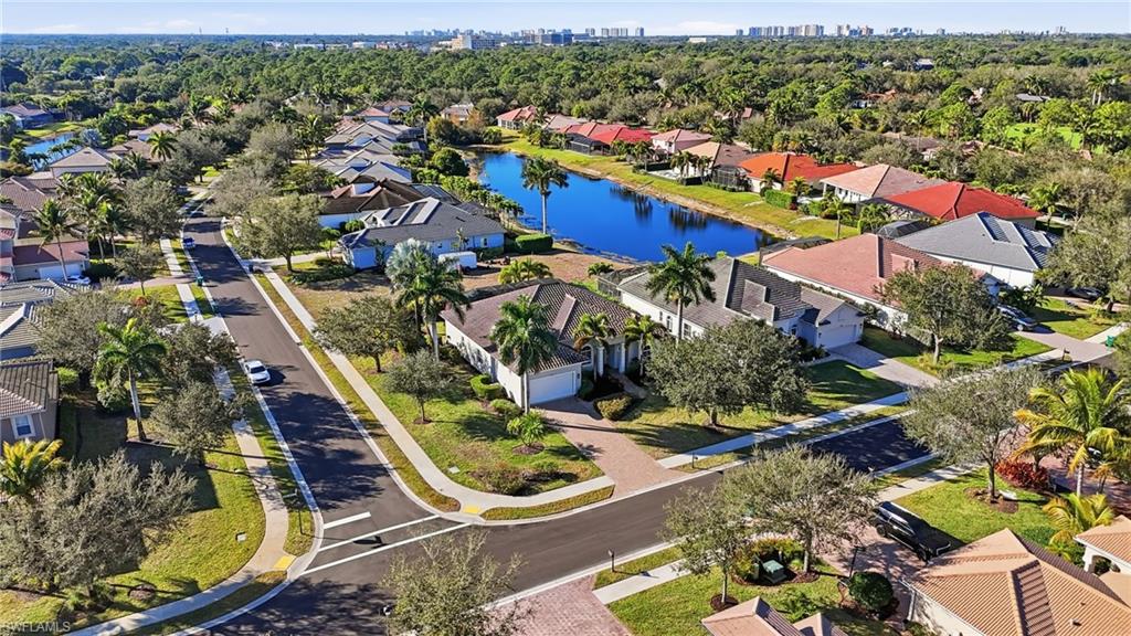 430 Saddlebrook Lane Naples, FL 34110 - Photo 34 of 37 an aerial view of residential houses with outdoor space