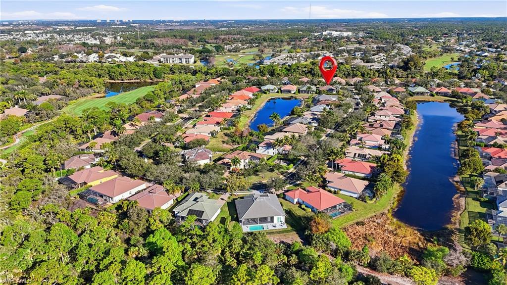 430 Saddlebrook Lane Naples, FL 34110 - Photo 36 of 37 an aerial view of residential houses with outdoor space and trees