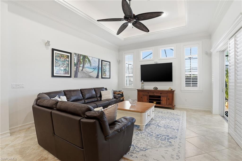 430 Saddlebrook Lane Naples, FL 34110 - Photo 5 of 37 a living room with furniture and a flat screen tv