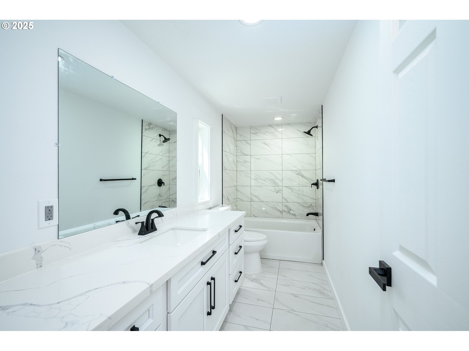 13620 Southwest Beef Bend Road, Unit 38 Portland, OR 97224 - Photo 14 of 38 a bathroom with a double vanity sink a toilet a mirror and shower