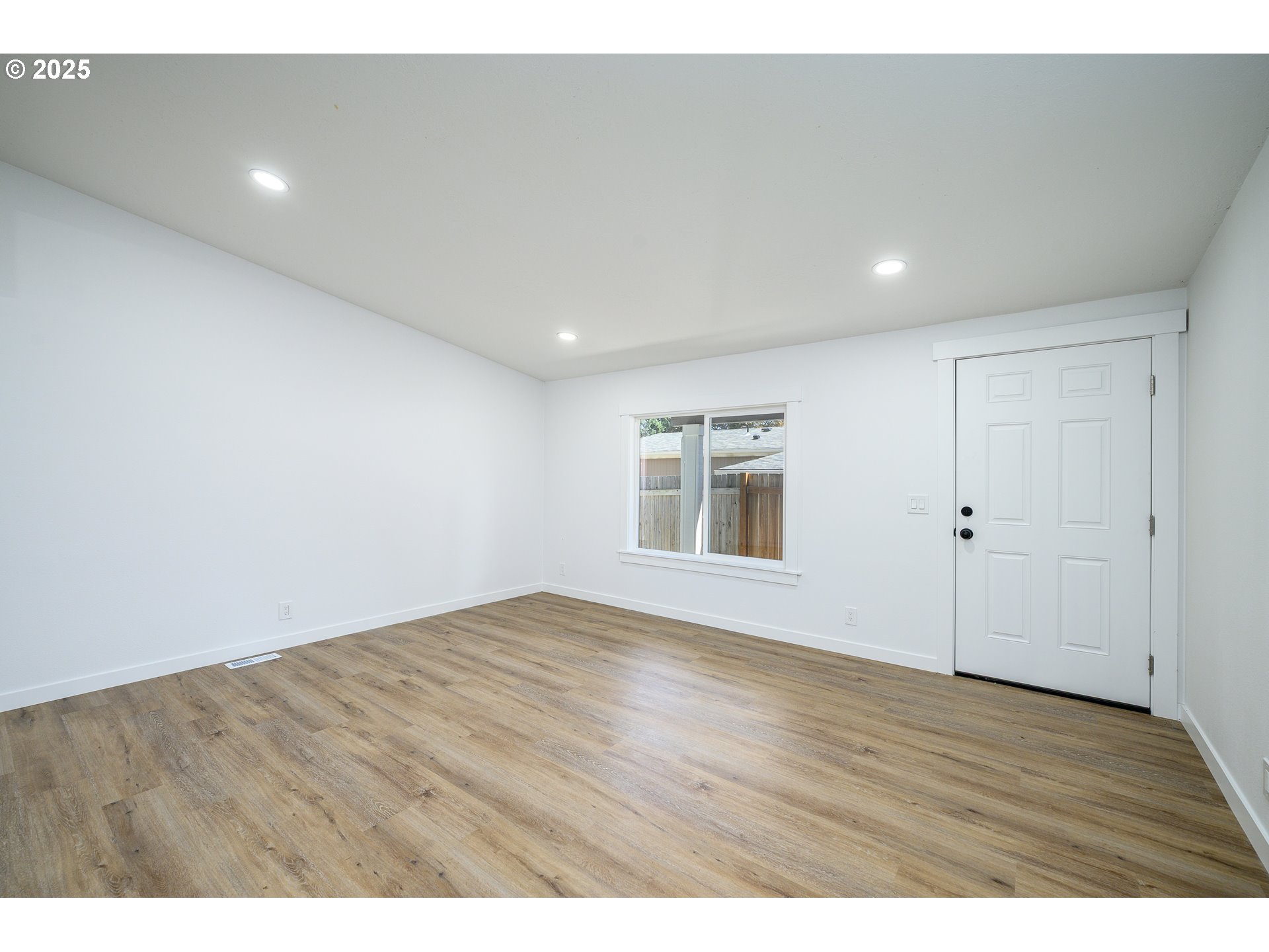 13620 Southwest Beef Bend Road, Unit 38 Portland, OR 97224 - Photo 3 of 38 a view of an empty room with wooden floor