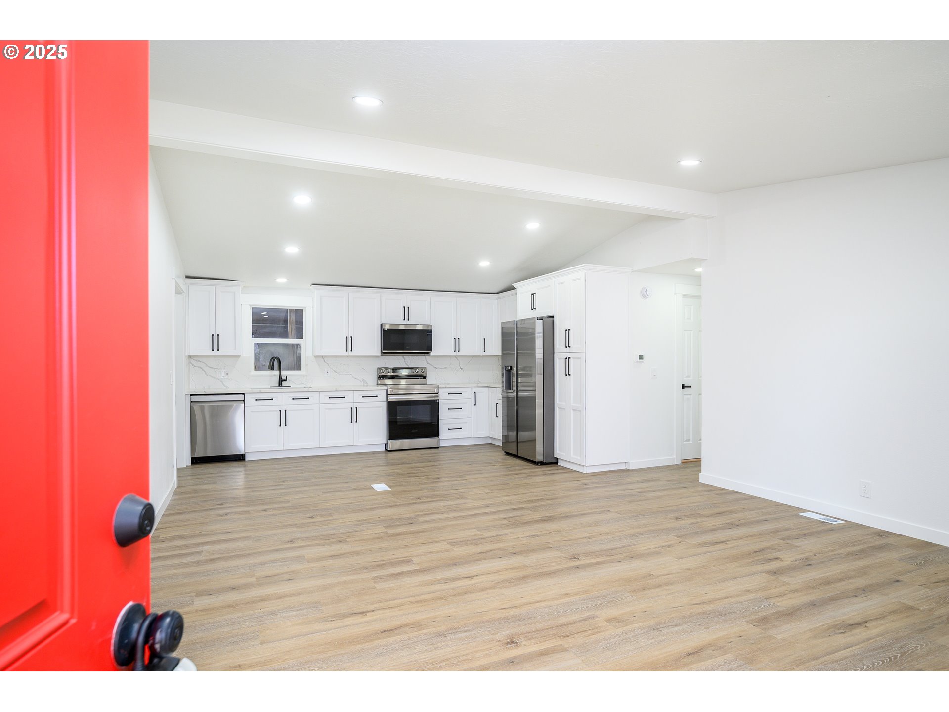 13620 Southwest Beef Bend Road, Unit 38 Portland, OR 97224 - Photo 37 of 38 a view of kitchen with kitchen island stainless steel appliances wooden cabinets
