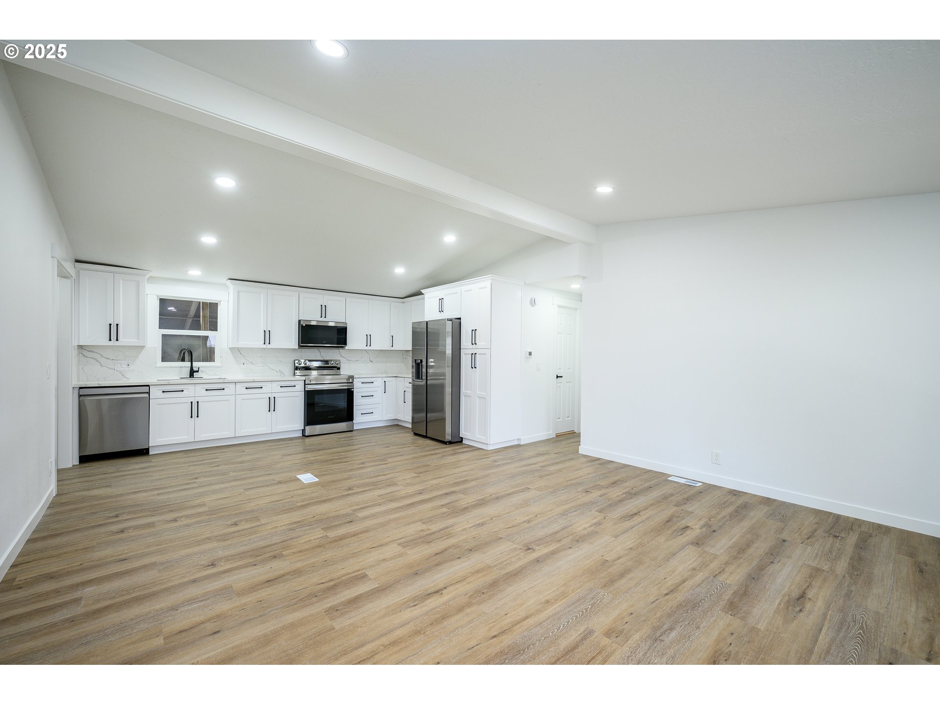 13620 Southwest Beef Bend Road, Unit 38 Portland, OR 97224 - Photo 38 of 38 a view of kitchen with a sink wooden cabinets and windows