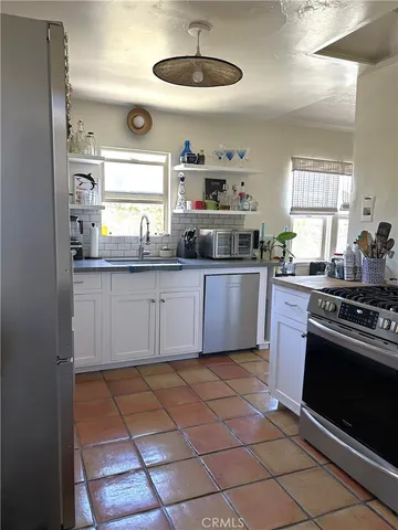 a view of a backyard with sitting area