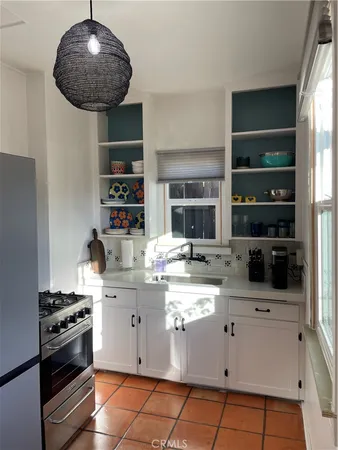 a view of storage and utility room with washer and dryer