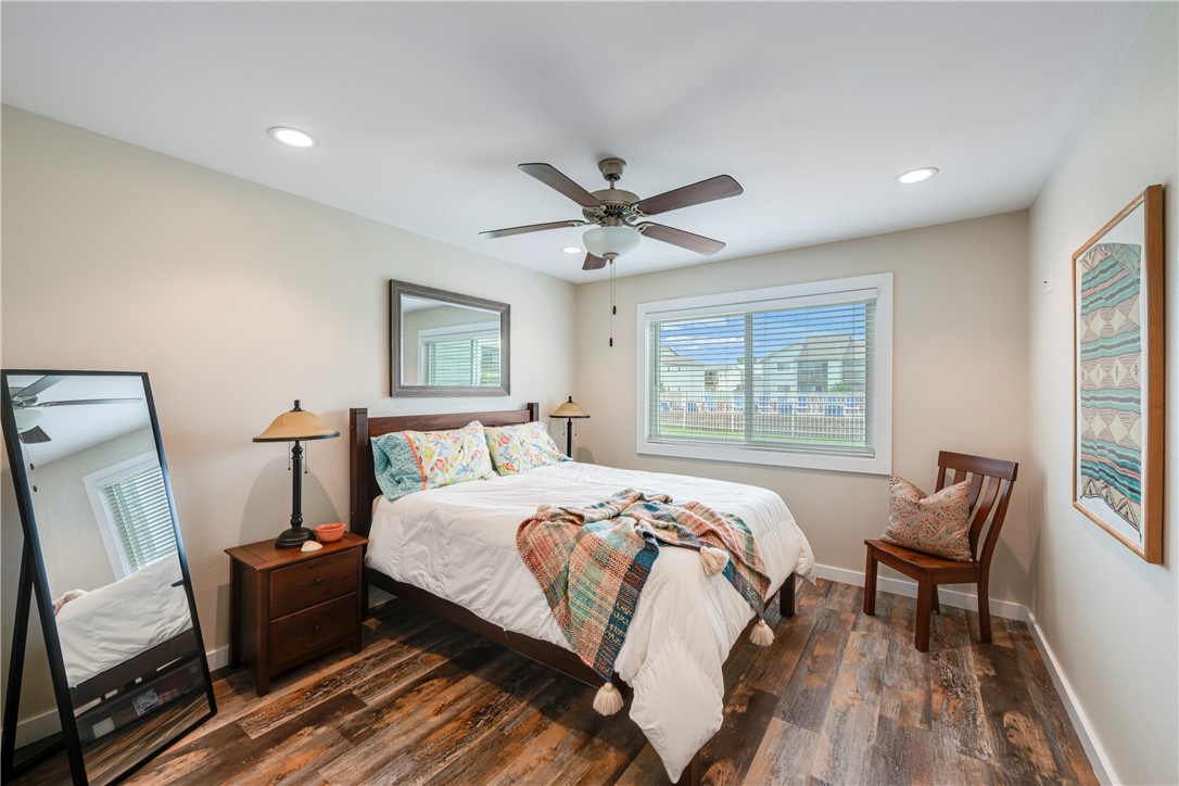 230 Cut-Off Road, Unit 101 Port Aransas, TX 78373 - Photo 14 of 30 a bed room with a bed and a window