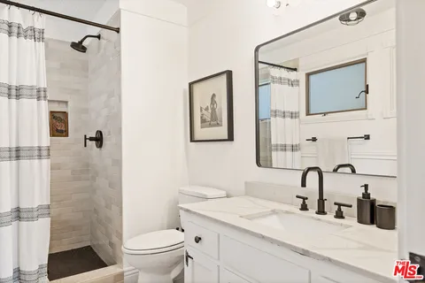 a living room with furniture a piano and a window