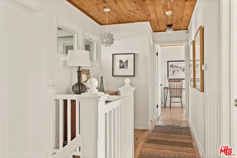 a bedroom with a bed and a fireplace