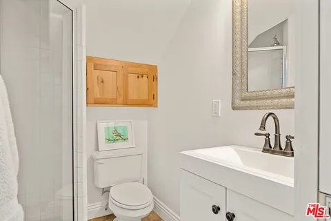 a view of a patio with table and chairs and wooden floor