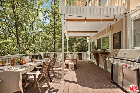 a view of a patio with table and chairs