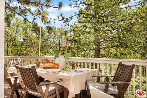 a view of a patio with a table and chairs