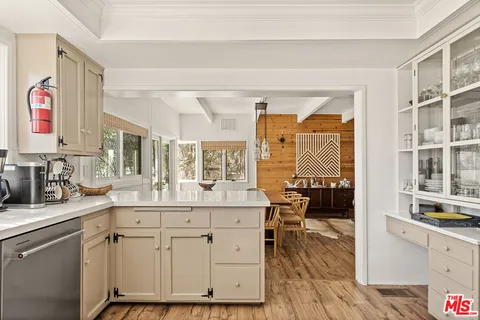 a kitchen with stainless steel appliances granite countertop a stove and a sink