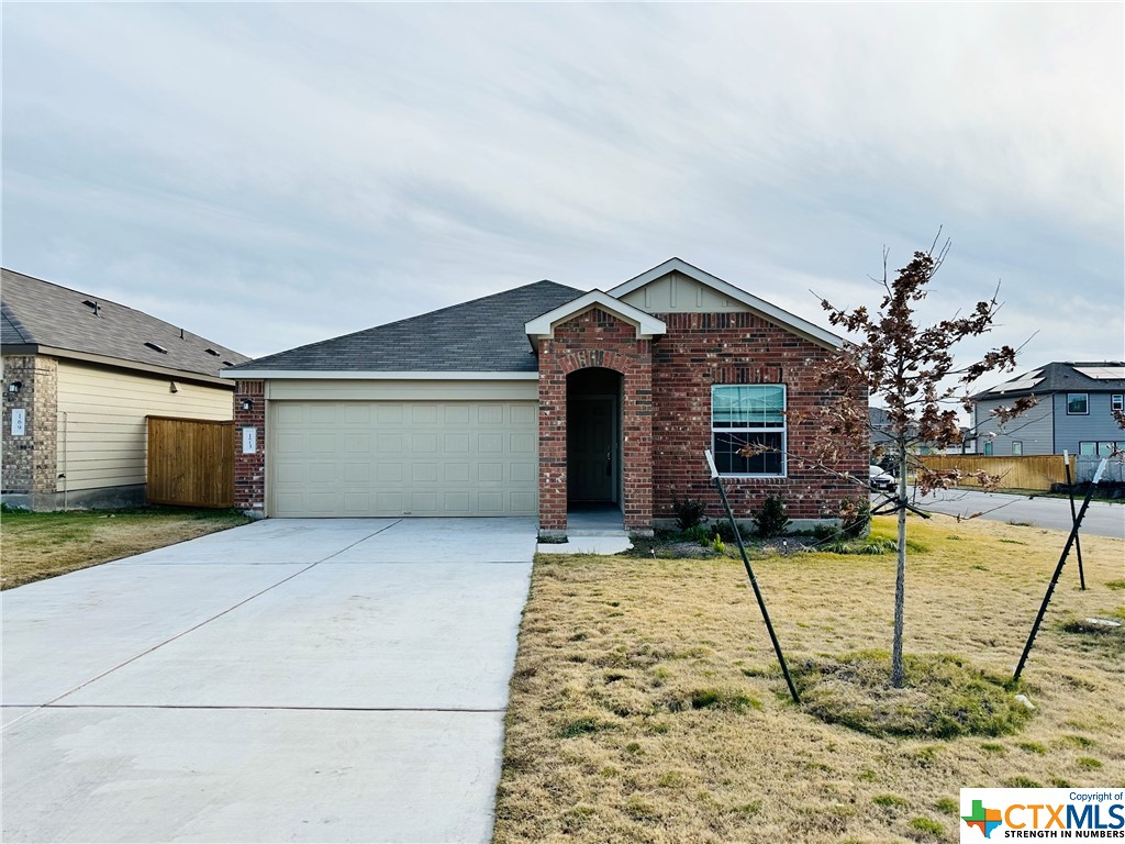 173 Perfect World Loop Jarrell, TX 76537 - Photo 1 of 1 a view of a house with a garage