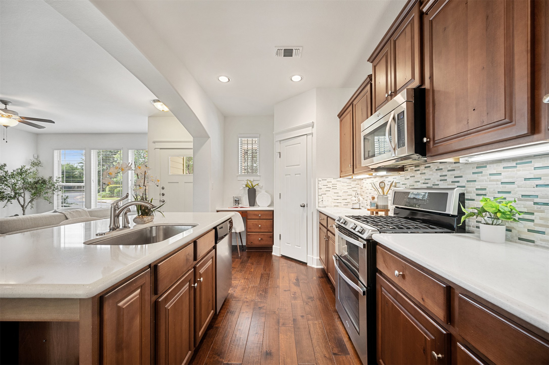 11013 Avery Station Loop, Unit 31 Austin, TX 78717 - Photo 19 of 38 The kitchen offers abundant storage with plenty of cabinets and counter space, ensuring everything has its place and keeping the space organized and clutter-free