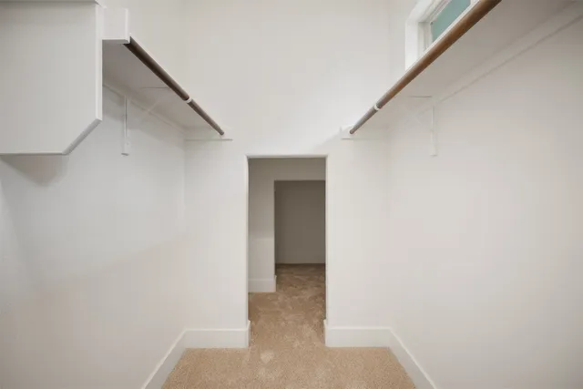 a view of kitchen with white cabinets