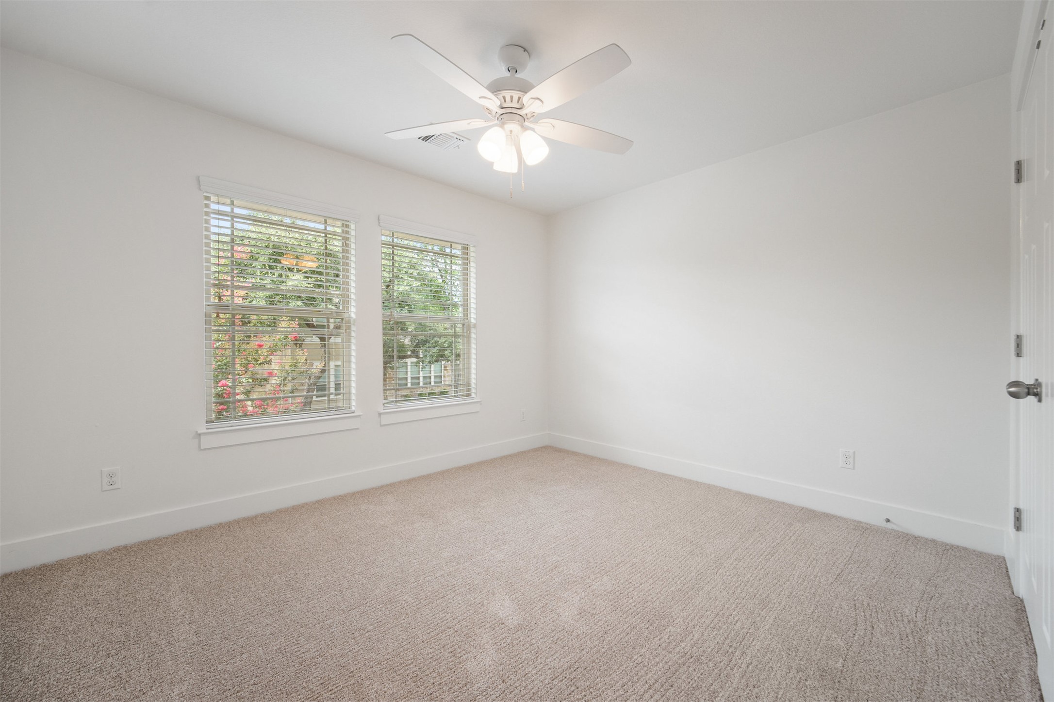 11013 Avery Station Loop, Unit 31 Austin, TX 78717 - Photo 27 of 38 The upstairs guest bedroom offers plenty of natural light, making it a bright and welcoming space for family or visitors to feel right at home