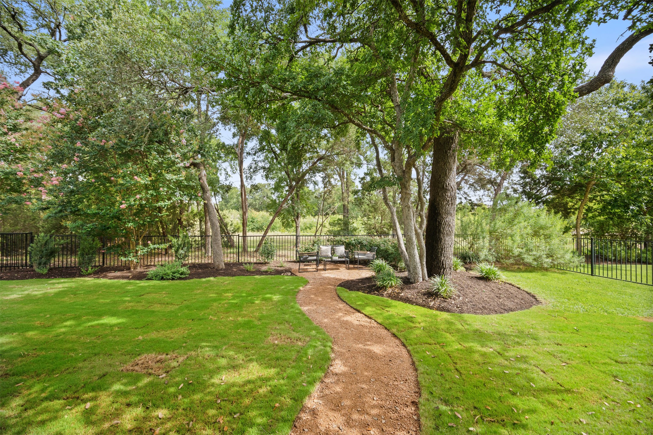11013 Avery Station Loop, Unit 31 Austin, TX 78717 - Photo 32 of 38 A gravel path leads you to a peaceful sitting area where you can sit back and enjoy the soothing sounds of nature along the greenbelt
