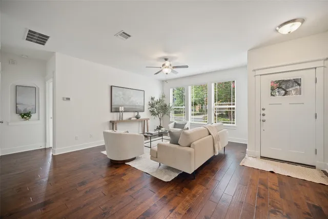 a living room with furniture and a large window