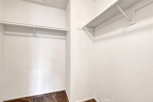 a bathroom with a sink mirror and toilet