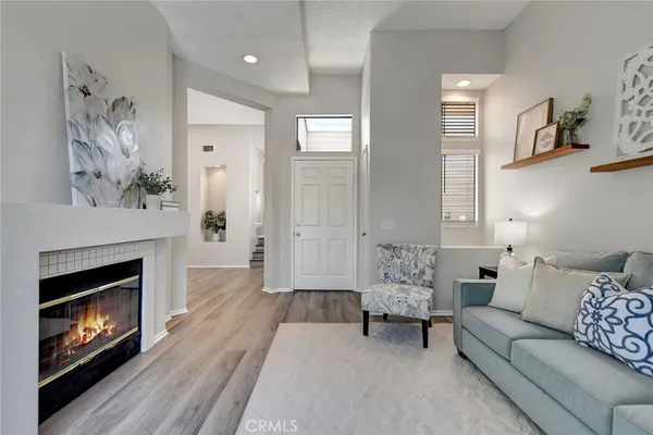 a living room with furniture and a fireplace