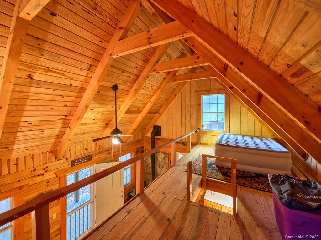 784 Flat Branch Road Waynesville, NC 28785 - Photo 17 of 25 a view of a balcony with chairs