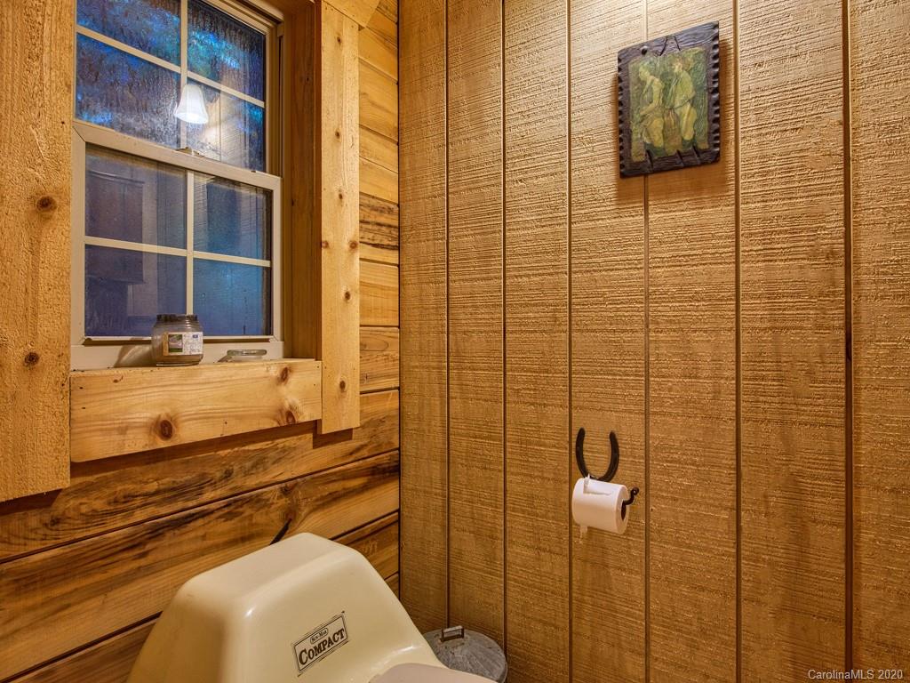 784 Flat Branch Road Waynesville, NC 28785 - Photo 20 of 25 a bathroom with a toilet and shower