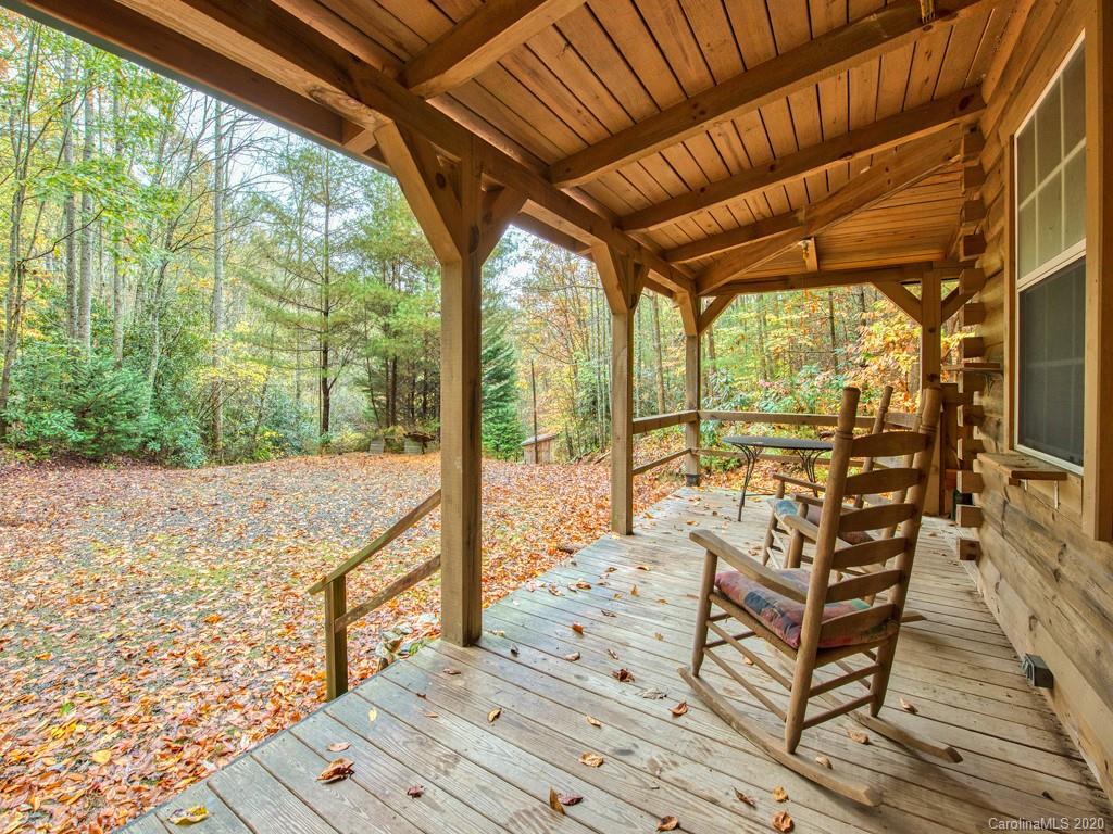 784 Flat Branch Road Waynesville, NC 28785 - Photo 3 of 25 a view of two chairs in the balcony