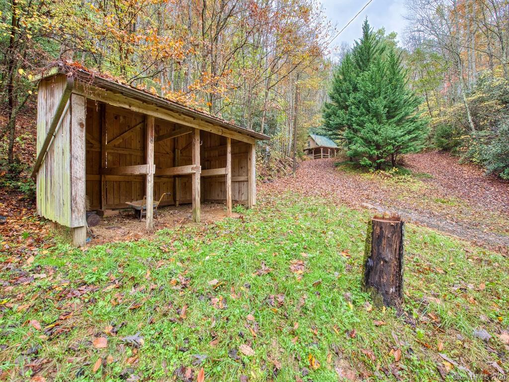 784 Flat Branch Road Waynesville, NC 28785 - Photo 23 of 25 a view of a house with a yard
