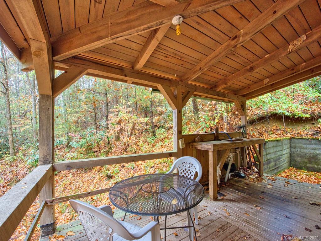 784 Flat Branch Road Waynesville, NC 28785 - Photo 5 of 25 a view of a chairs and table in the balcony