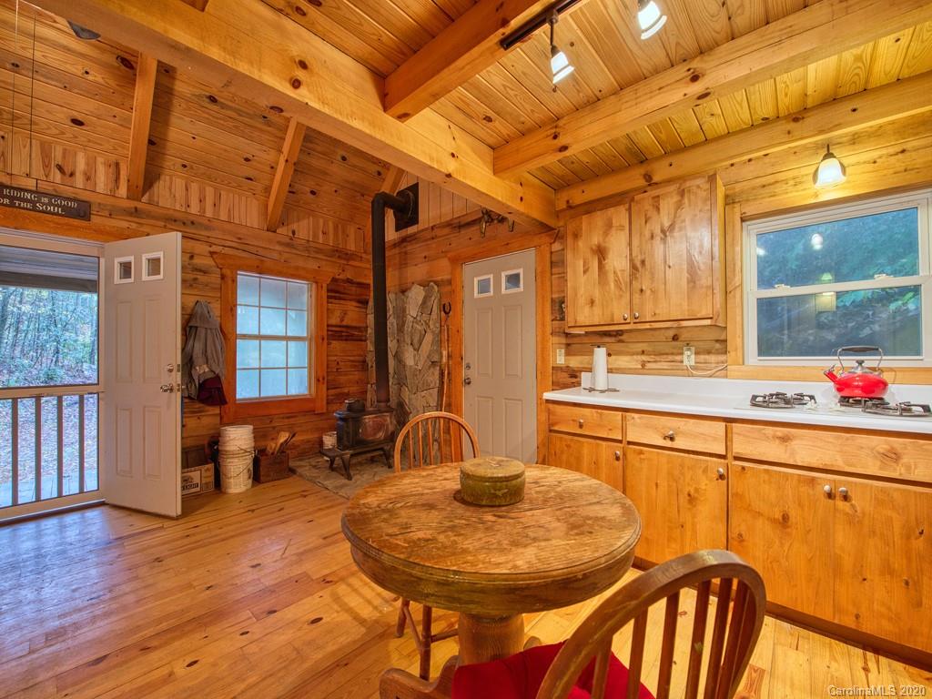 784 Flat Branch Road Waynesville, NC 28785 - Photo 9 of 25 a dinning room with a table and chairs