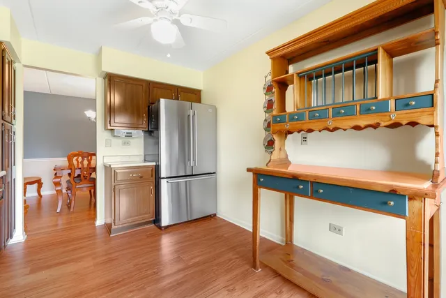a kitchen with stainless steel appliances a refrigerator and a stove top oven