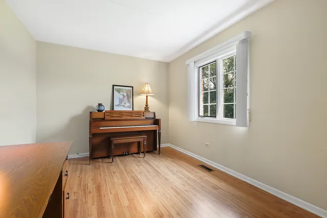 a room with a bed and a window