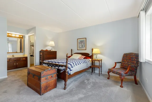 a living room with furniture and a lamp