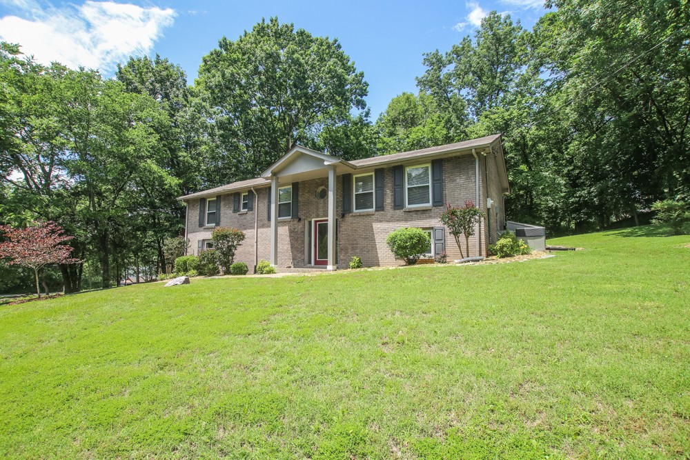 590 Weeping Elm Road Mount Juliet, TN 37122 - Photo 1 of 20 a view of a house with backyard and garden
