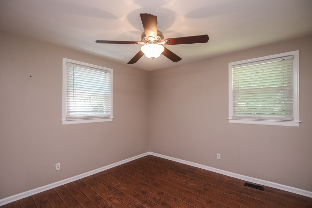 590 Weeping Elm Road Mount Juliet, TN 37122 - Photo 12 of 20 a view of empty room with wooden floor and fan