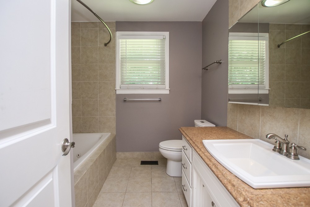 590 Weeping Elm Road Mount Juliet, TN 37122 - Photo 14 of 20 a bathroom with a granite countertop sink toilet and shower